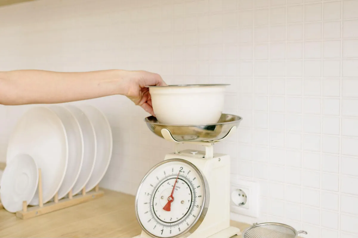 A bowl being placed on a kitchen scale